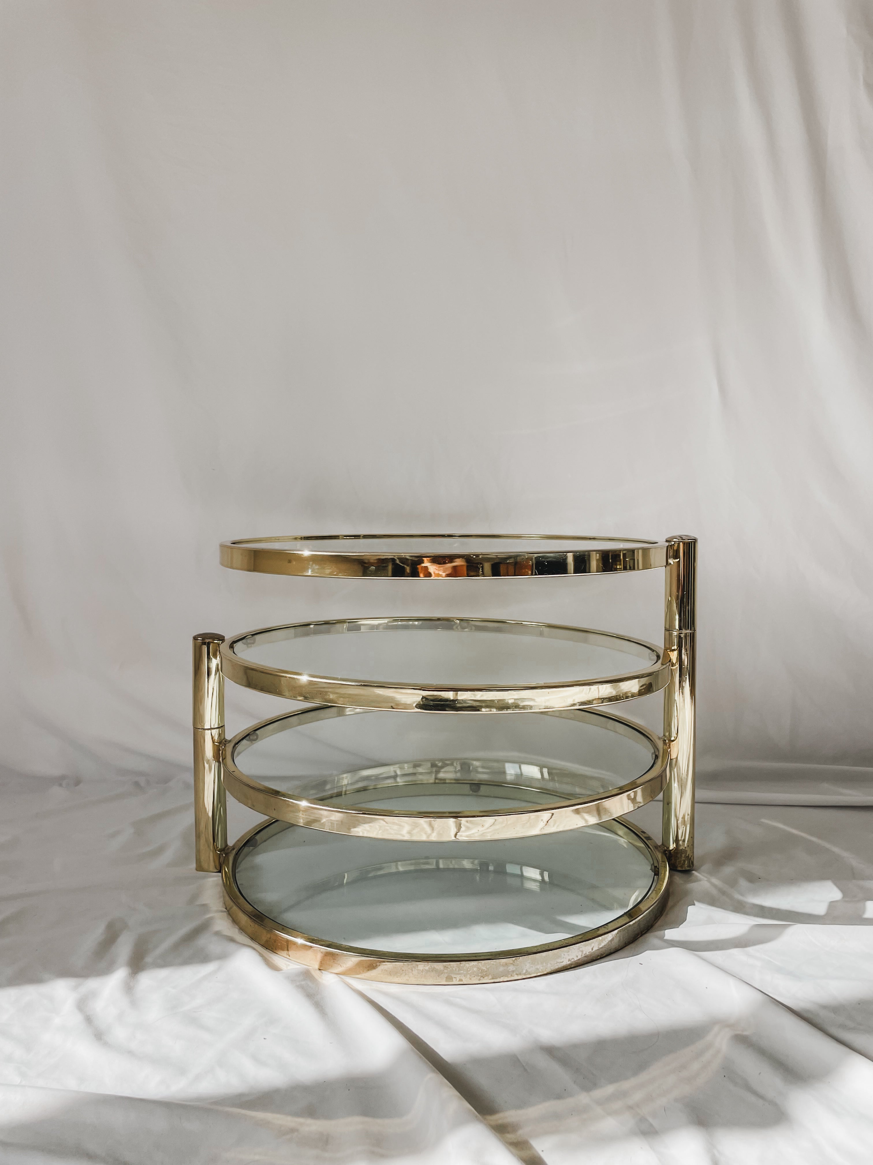 VINTAGE BRASS AND GLASS 4 TIER SWIVEL TABLE