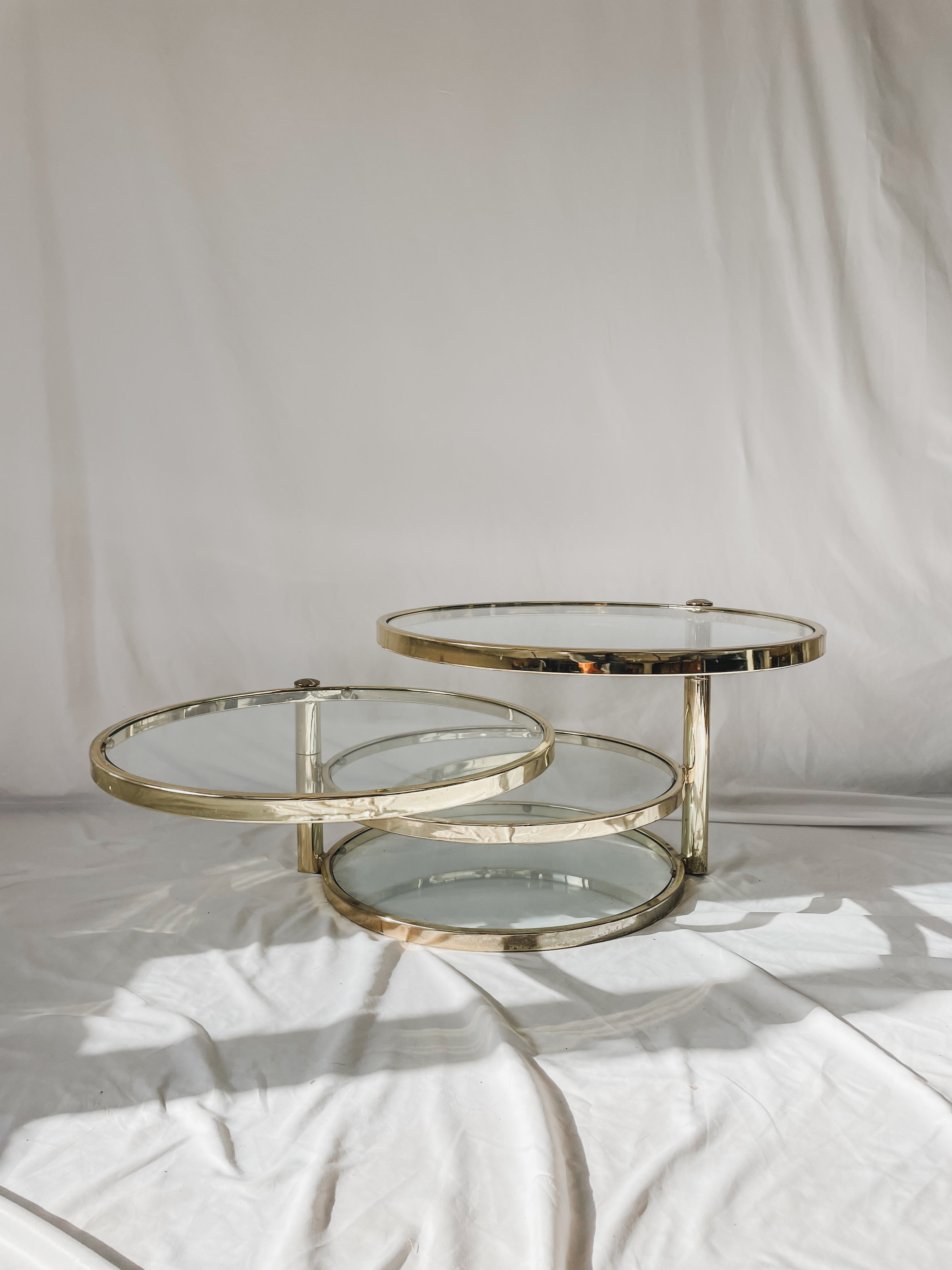 VINTAGE BRASS AND GLASS 4 TIER SWIVEL TABLE