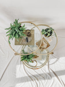 VINTAGE BRASS AND GLASS 4 TIER SWIVEL TABLE