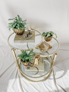 VINTAGE BRASS AND GLASS 4 TIER SWIVEL TABLE