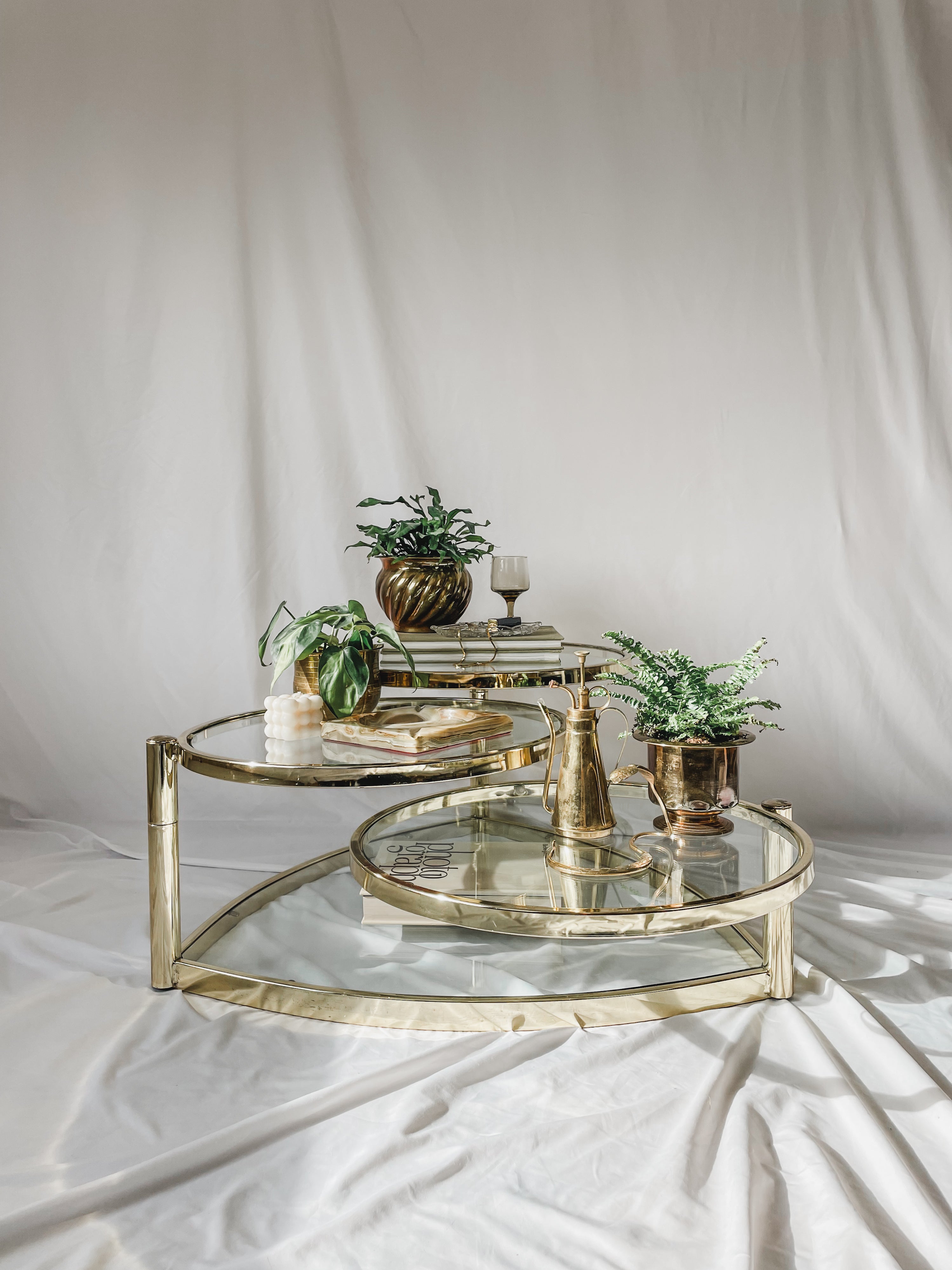 VINTAGE BRASS AND GLASS 4 TIER SWIVEL COFFEE TABLE