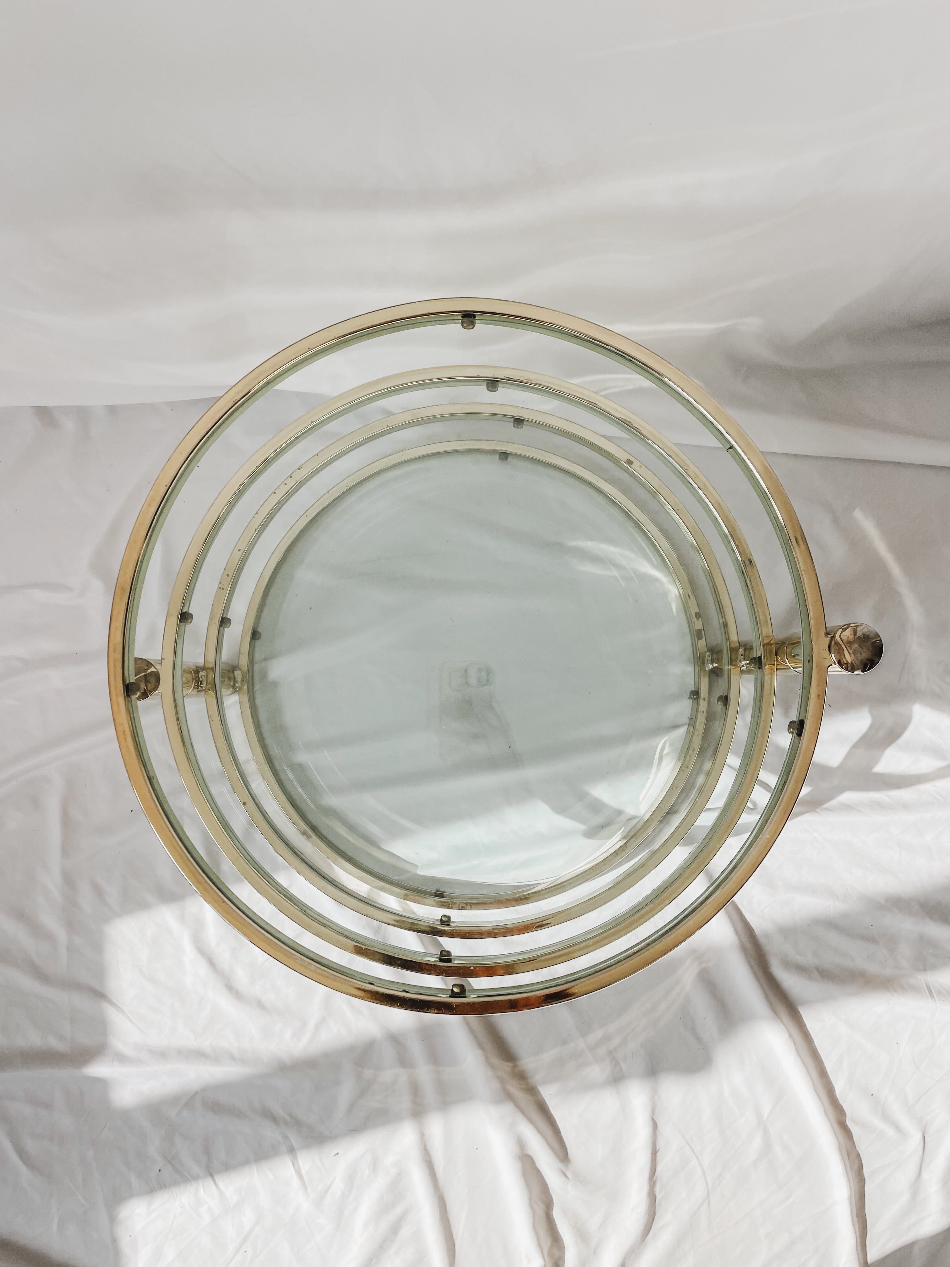 VINTAGE BRASS AND GLASS 4 TIER SWIVEL TABLE