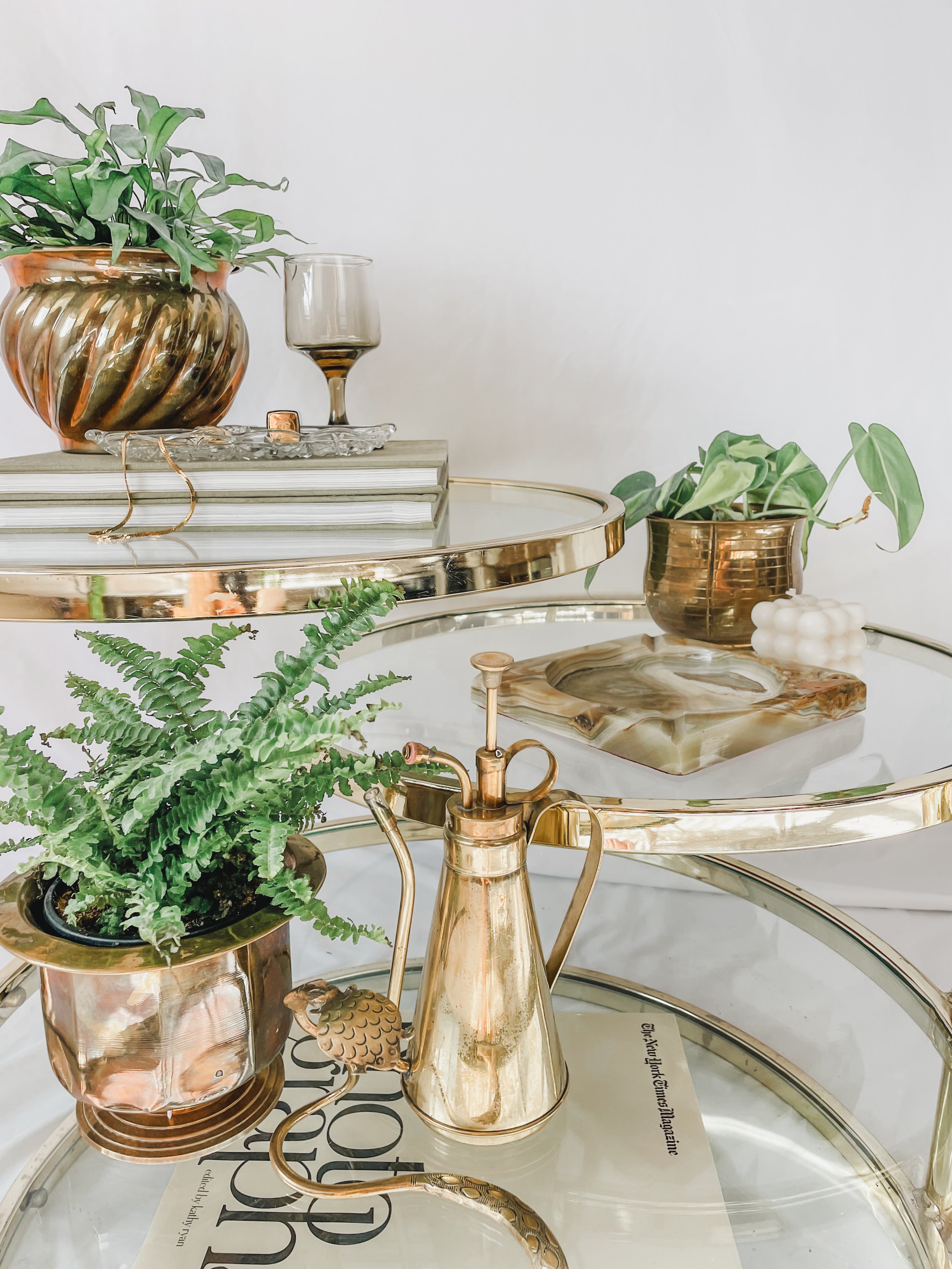 VINTAGE BRASS AND GLASS 4 TIER SWIVEL TABLE