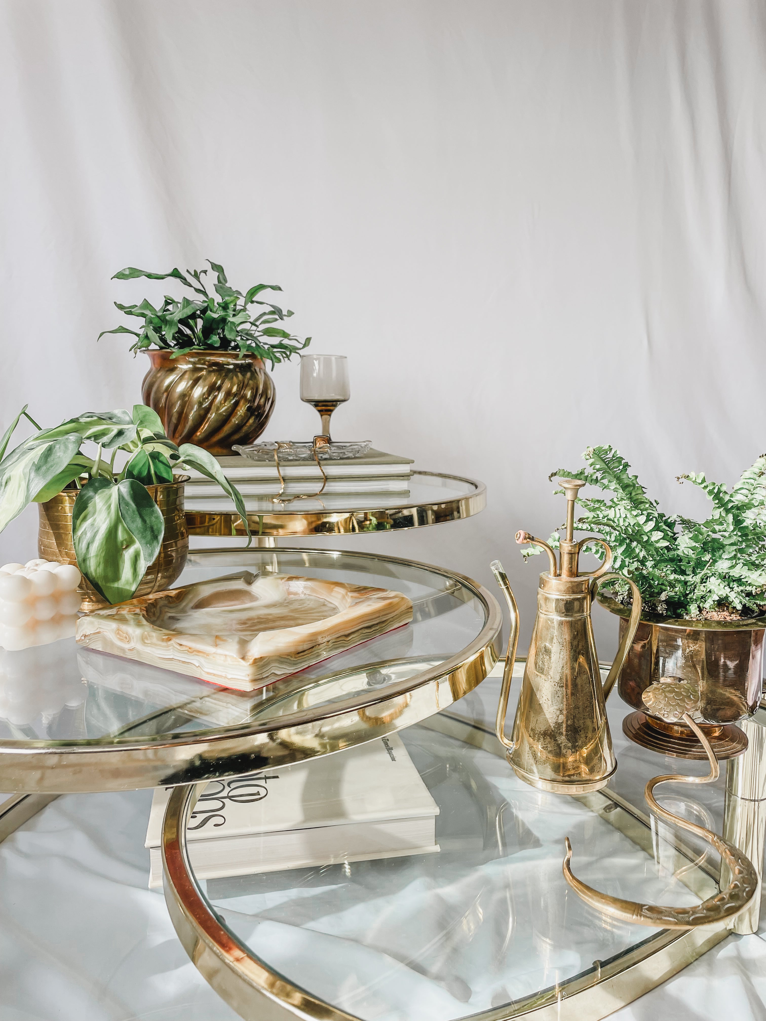 VINTAGE BRASS AND GLASS 4 TIER SWIVEL COFFEE TABLE