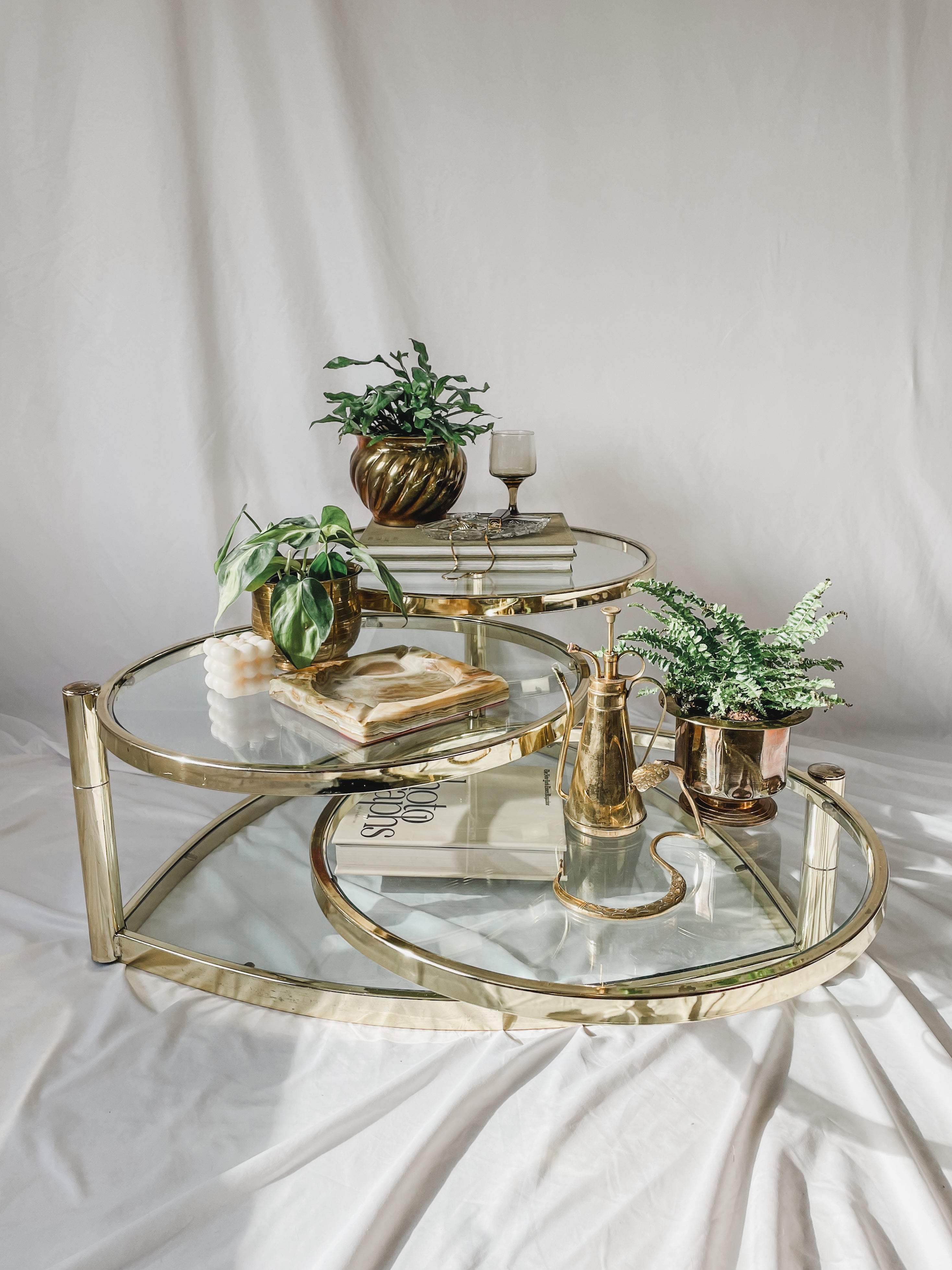 VINTAGE BRASS AND GLASS 4 TIER SWIVEL COFFEE TABLE