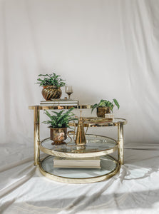 VINTAGE BRASS AND GLASS 4 TIER SWIVEL TABLE