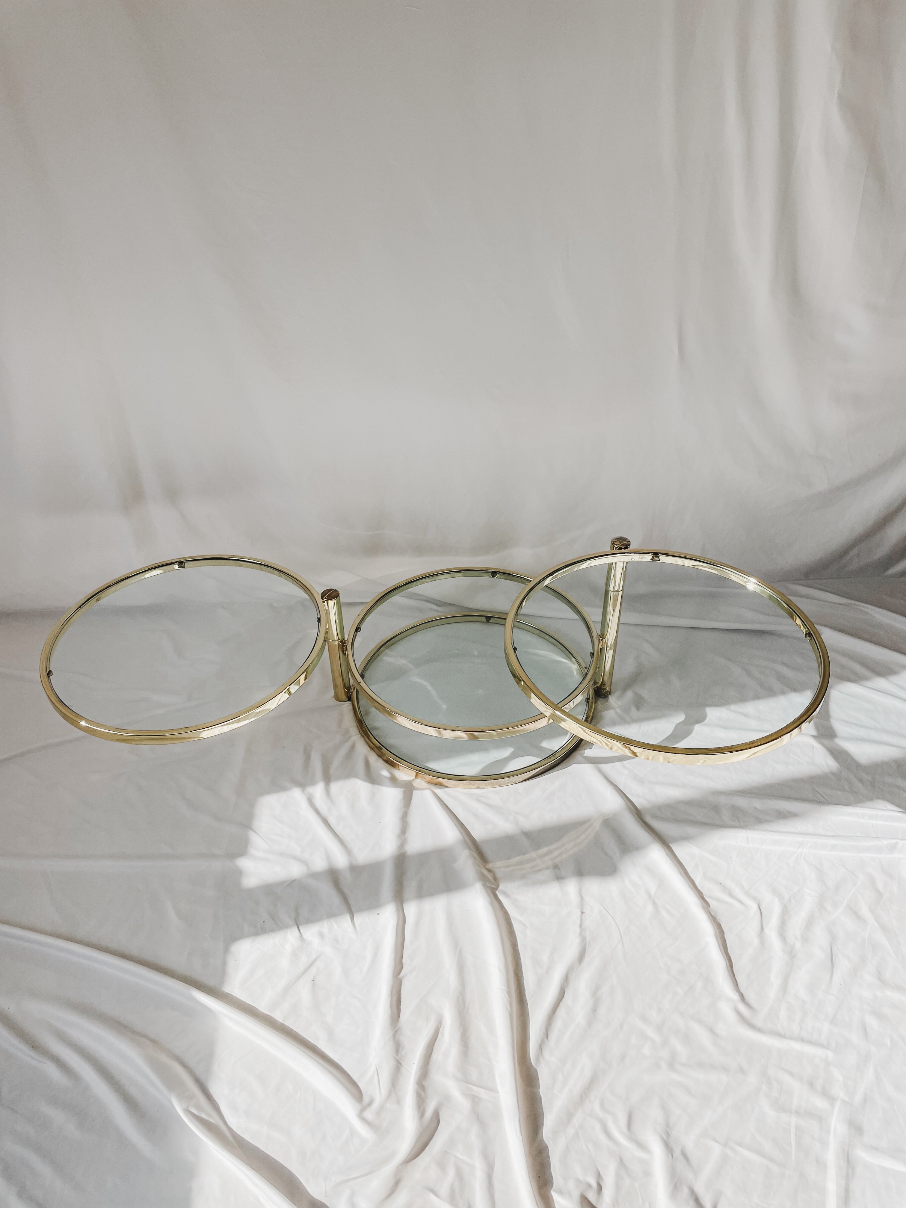 VINTAGE BRASS AND GLASS 4 TIER SWIVEL TABLE