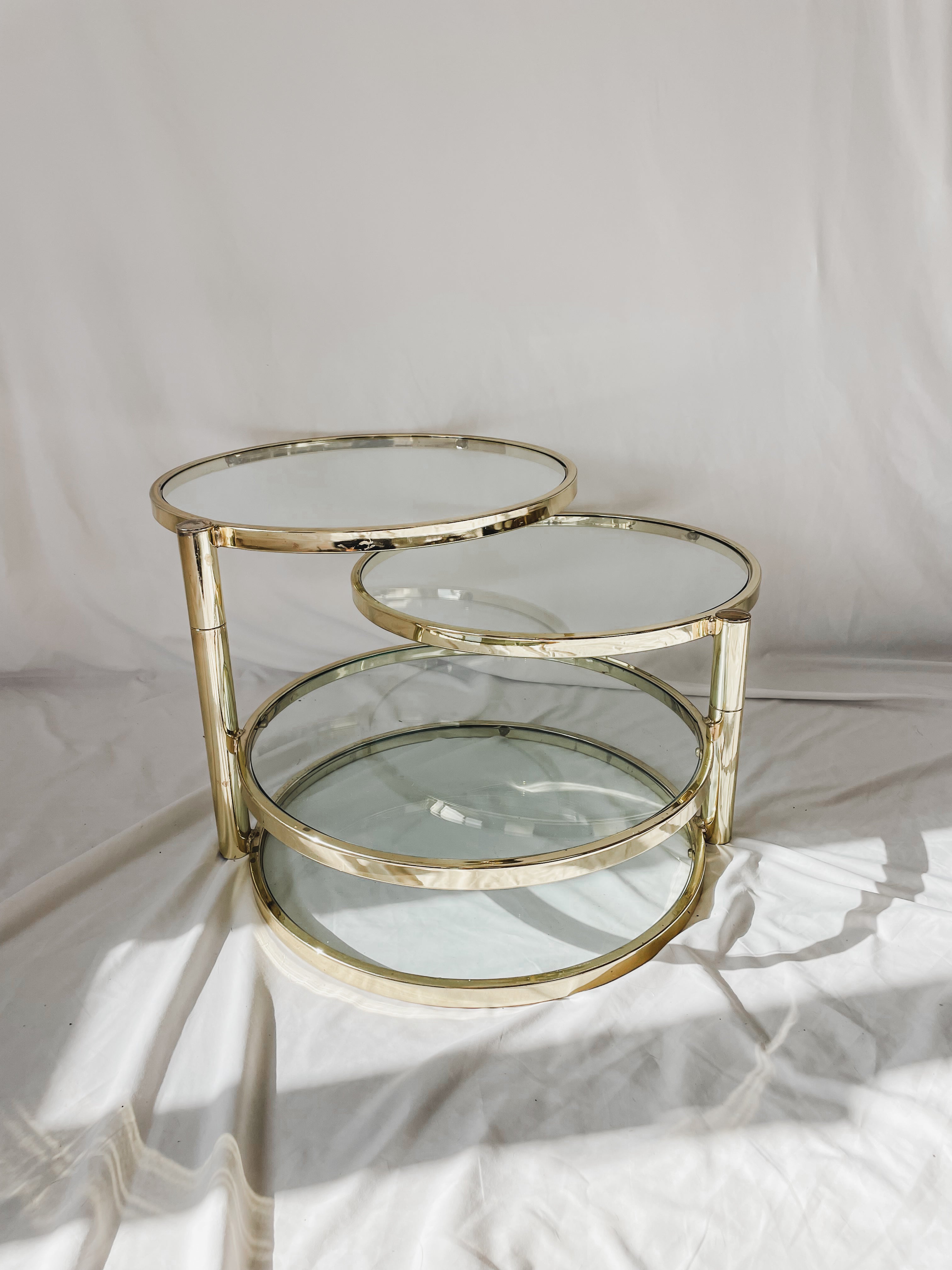 VINTAGE BRASS AND GLASS 4 TIER SWIVEL TABLE