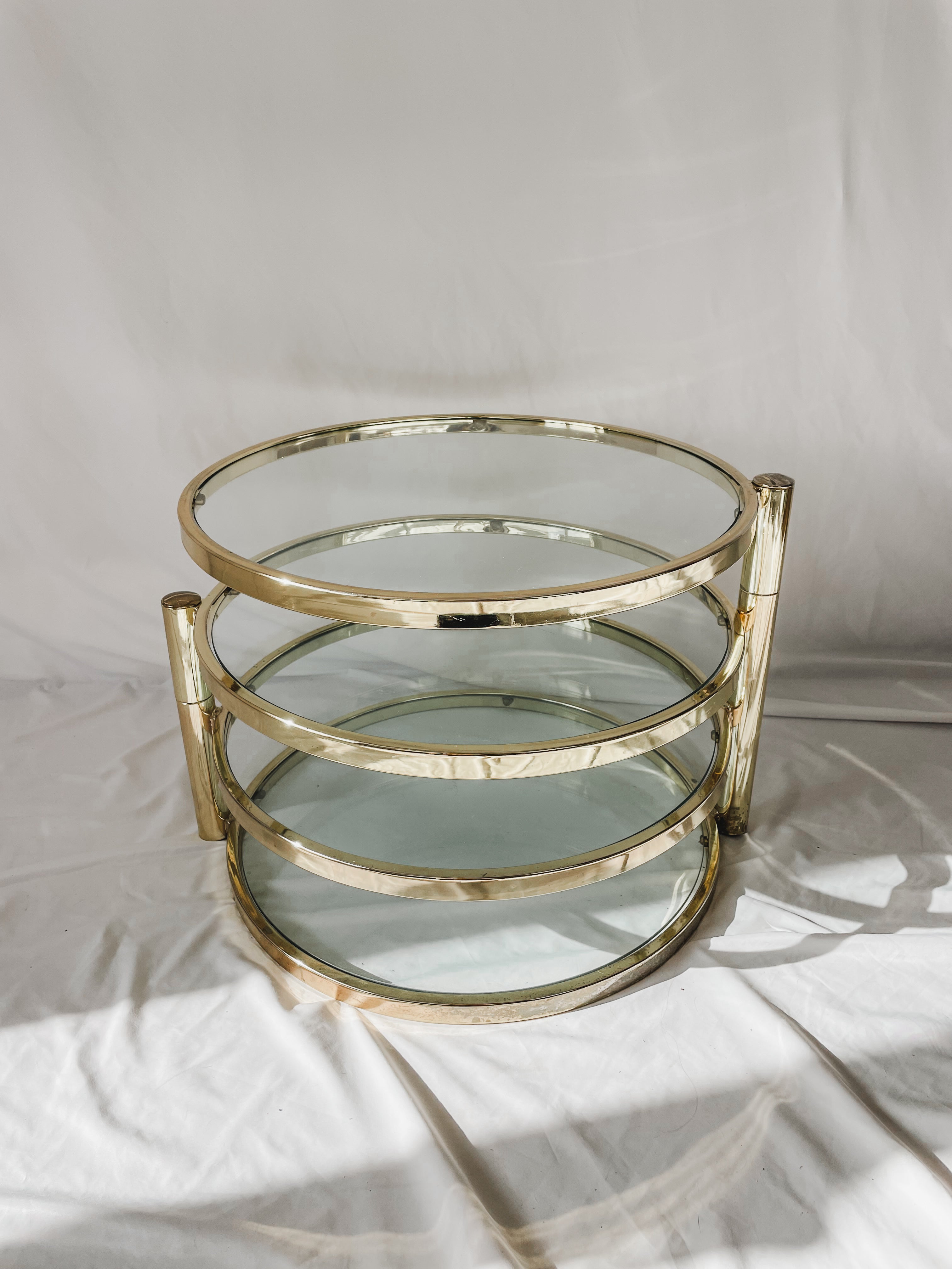 VINTAGE BRASS AND GLASS 4 TIER SWIVEL TABLE