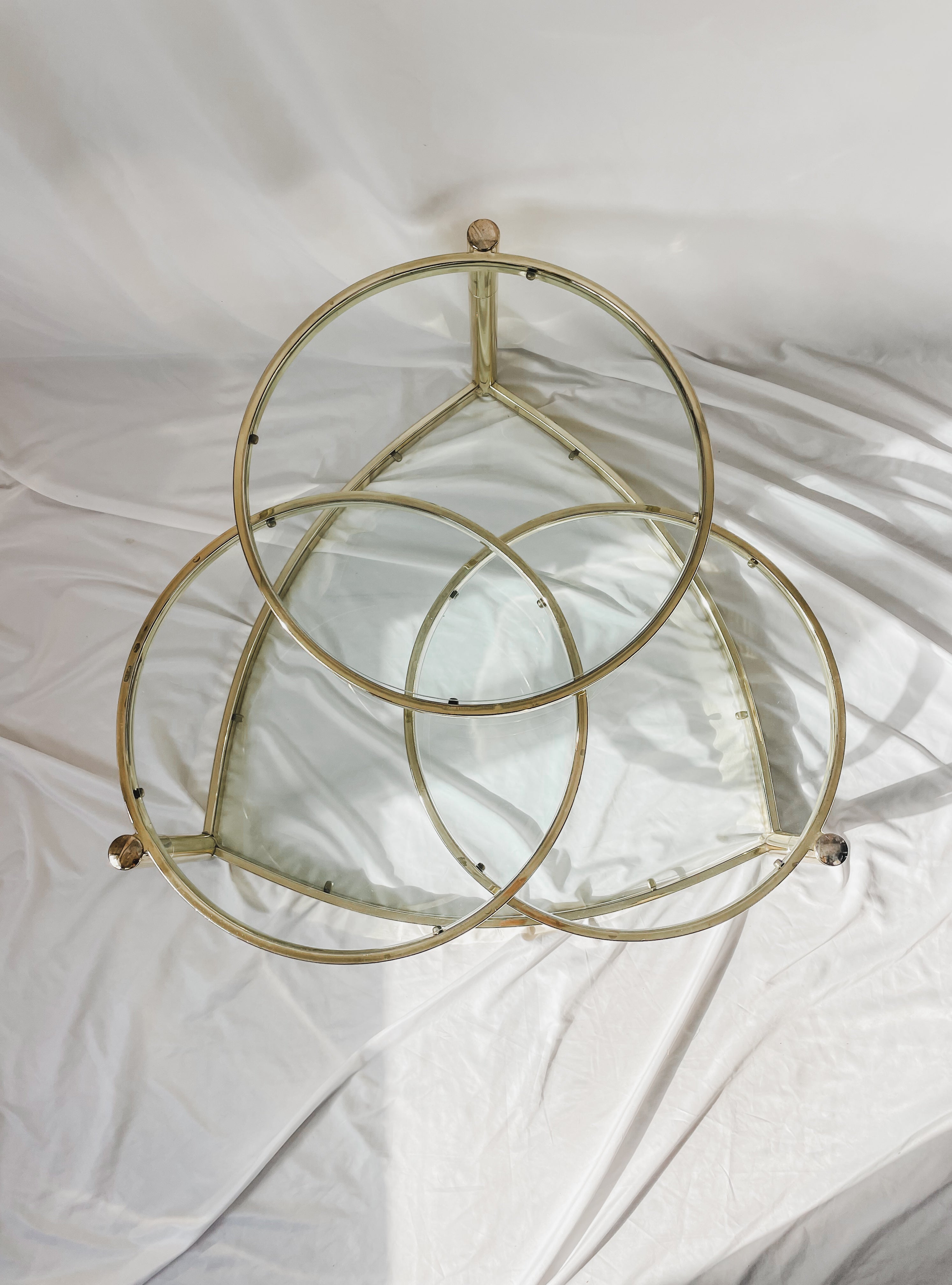 VINTAGE BRASS AND GLASS 4 TIER SWIVEL COFFEE TABLE