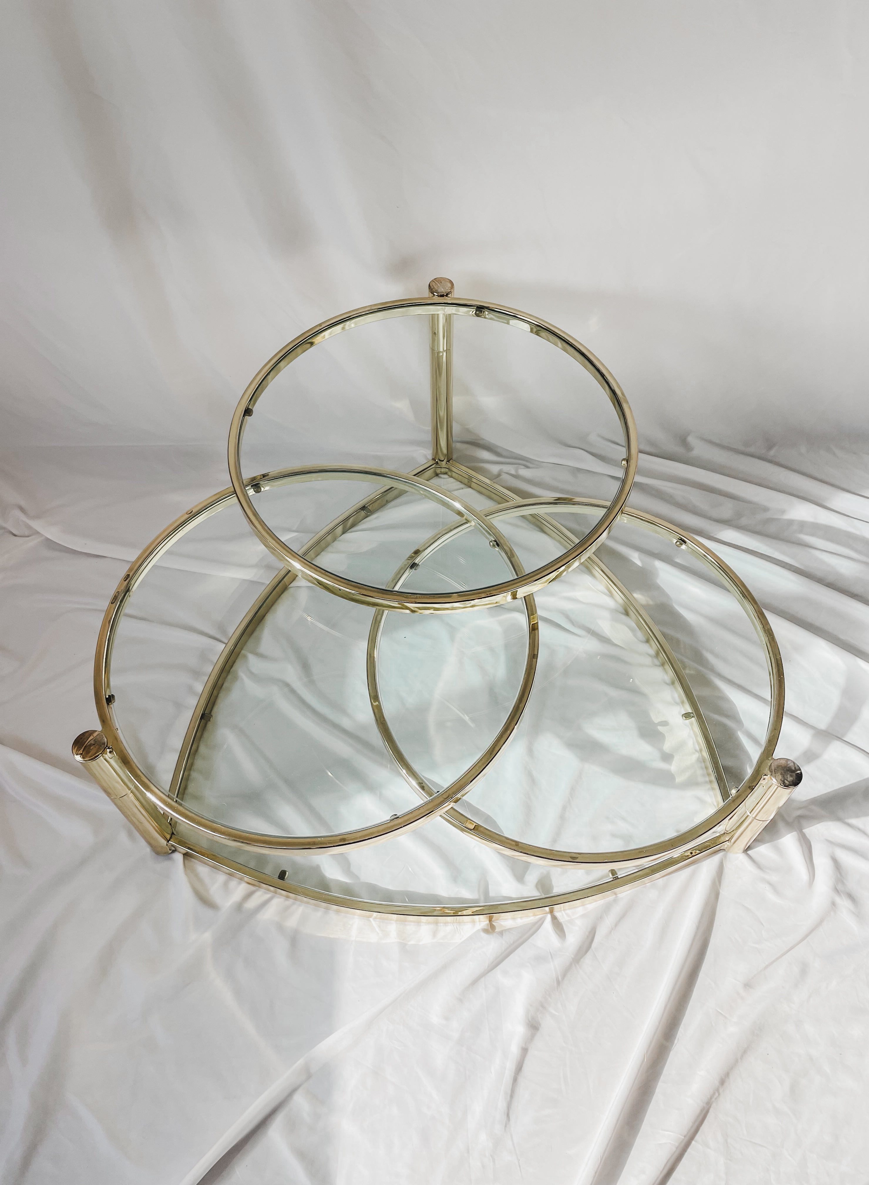 VINTAGE BRASS AND GLASS 4 TIER SWIVEL COFFEE TABLE